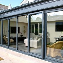 An image showing a 5 panel bifolding door installed by bifold by design in Beaconsfield.